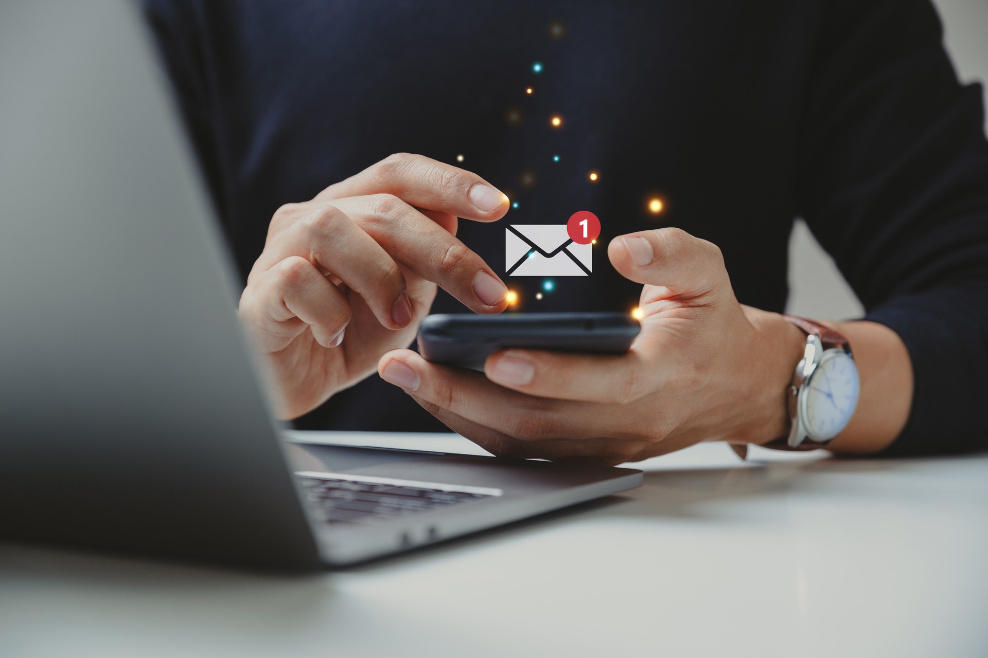 Hand of businessman using smartphone for email with notification alert.